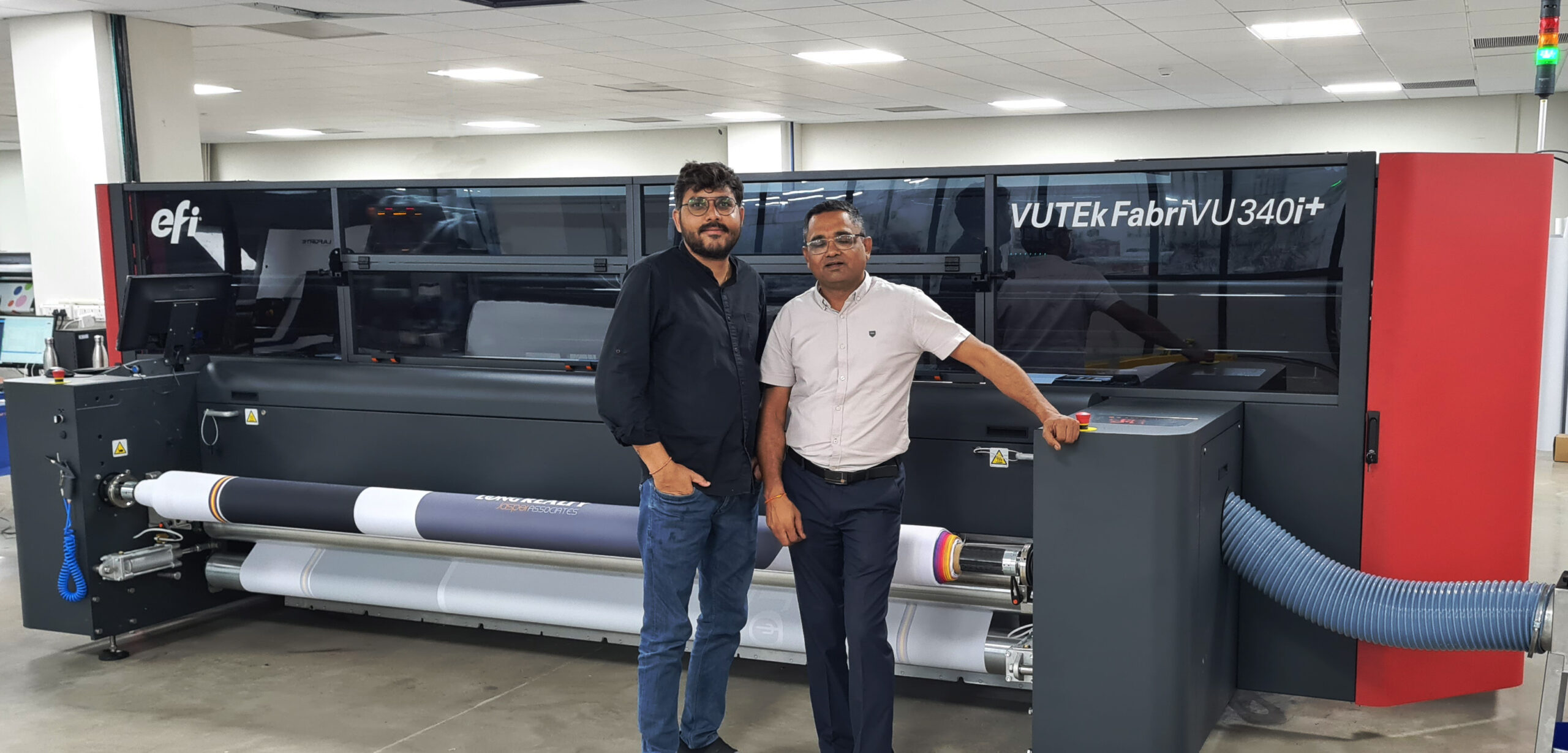 Caterpillar Signs Installs the First EFI VUTEk FabriVU 340i+ Soft Signage Printer at Ahmedabad.